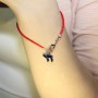 Evil Eye Blue Chai pendant on a red string bracelet